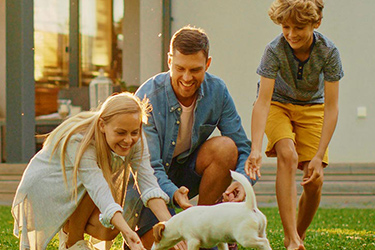 happy family with a dog | single-family home hoa management